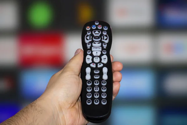 Person Holding Control Remote Television Screen Background — Stock Photo, Image