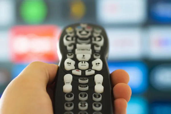 Close Person Holding Control Remote Television Screen Background — Stock Photo, Image