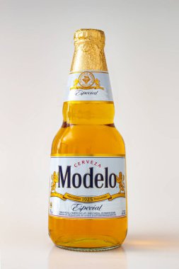 Calgary, Alberta, Canada. May 1, 2020. Modelo Especial beer bottle clear bright yellow colour on a white background clipart
