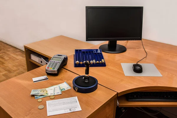 Post office. Postal stamp, bill, money, payment terminal and credit card on the desk