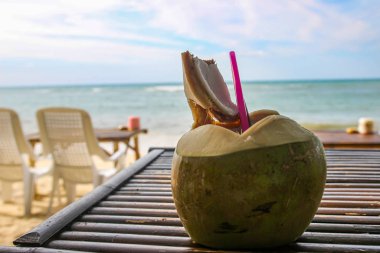 Fresh coconut ready to drink at beach