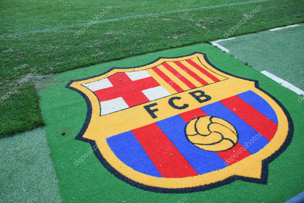 BARCELONA, SPAIN - JULY, 2013 : FC Barcelona logo at Camp Nou stadium field.