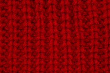 Örülmüş kırmızı battaniye makro dokusu. Sıcak kış arkaplanı.