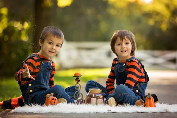 Two boys in the park with Halloween costumes, having fun — Stock Photo, Image