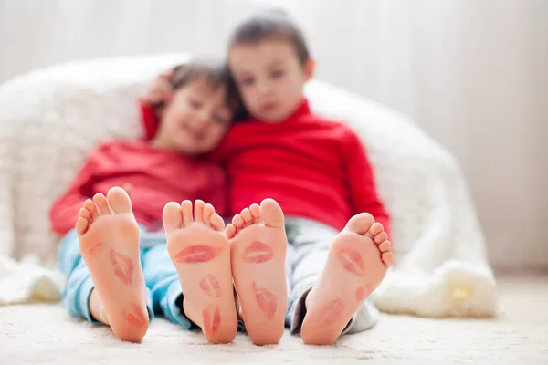 Little kids feet, covered with prints from kisses — Stock Photo, Image