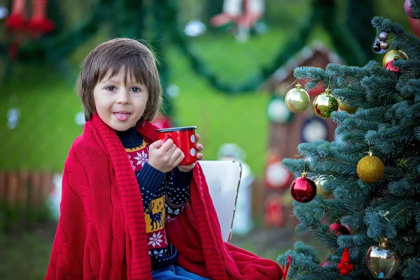 Cute little boy, decorating christmas tree, outdoor — Stock Photo, Image