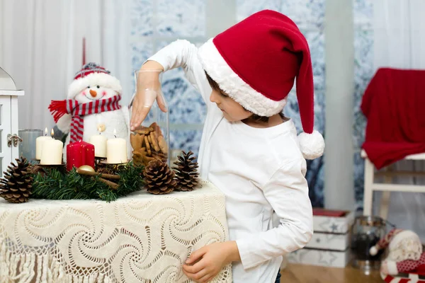 Christmas portrait of cute little preschool boy, eating cookies — Stock Photo, Image