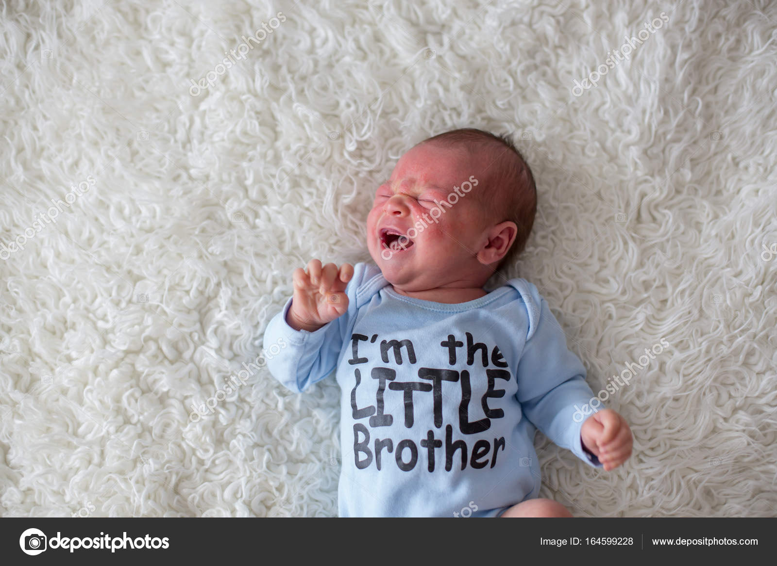 Little newborn baby crying, baby with skin rash Stock Photo by ©t
