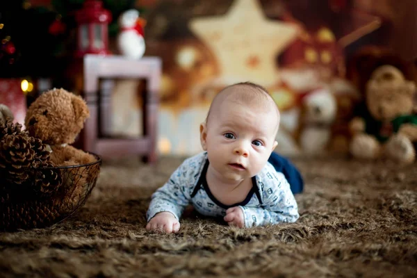 Portrait of newborn baby in Santa clothes in little baby bed — Stock Photo, Image