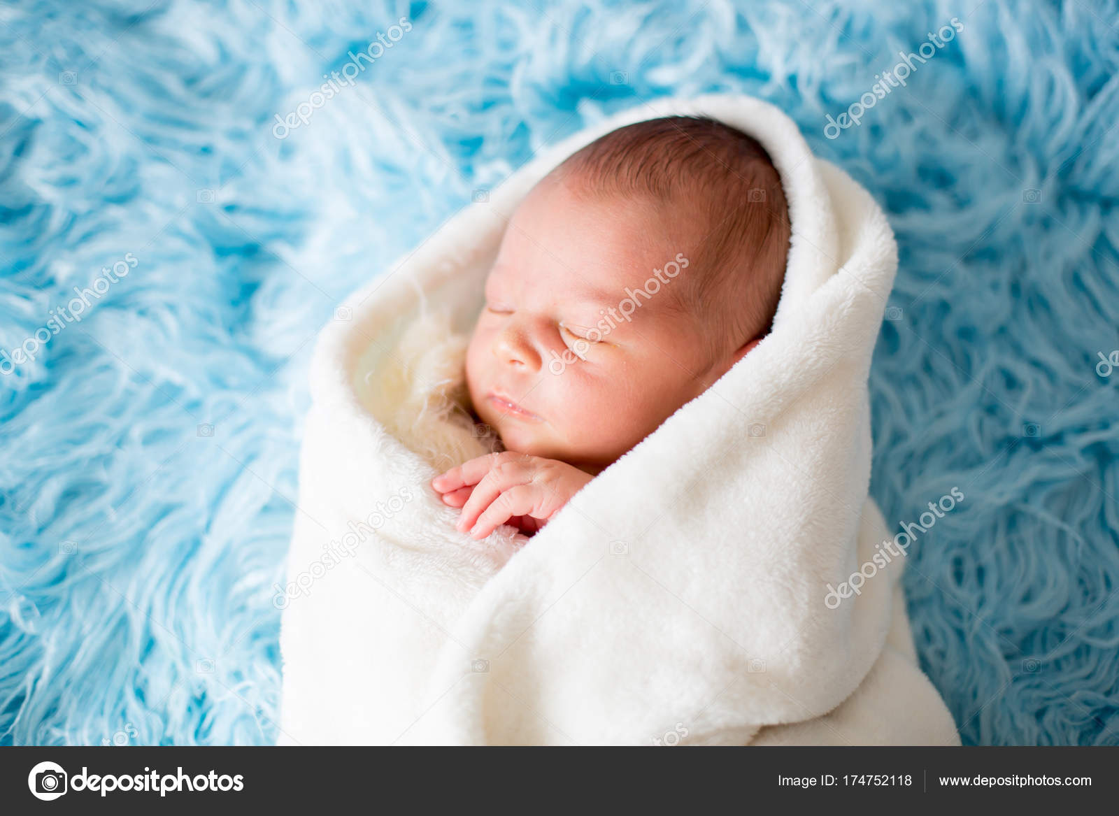 Little cute newborn baby boy, sleeping wrapped in white wrap Stock ...