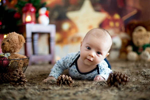 Portrait of newborn baby in Santa clothes in little baby bed — Stock Photo, Image