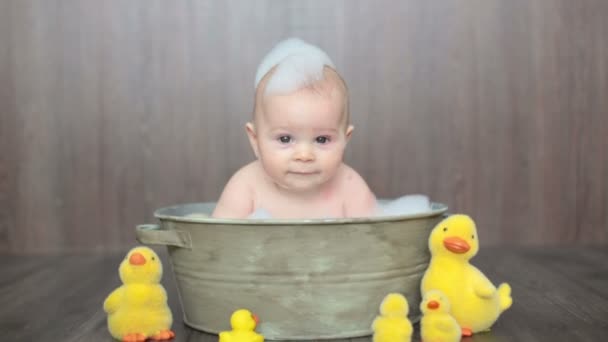 Cute Baby Playing Rubber Duck While Sitting Metal Basin Home — Stock Video