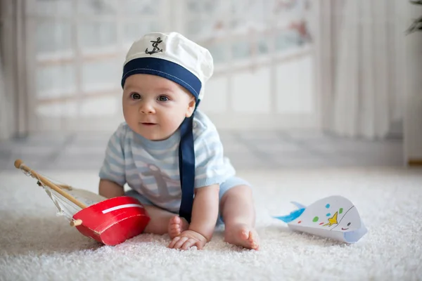 Little baby boy, playing wtih little boat and little fish at hom — Stock Photo, Image