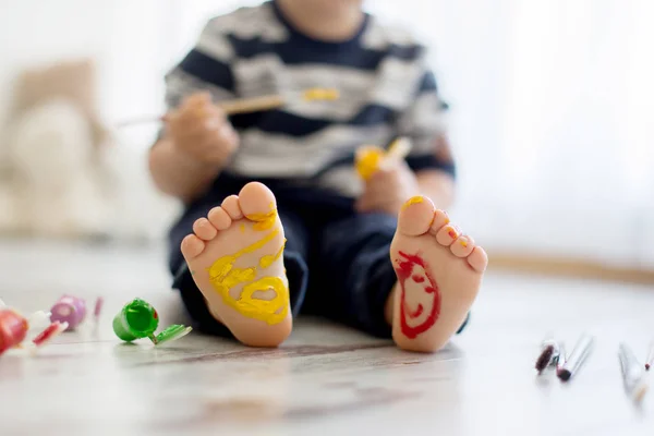 Brothers, playing at home, painting on their feet, tickling, lau — Stock Photo, Image