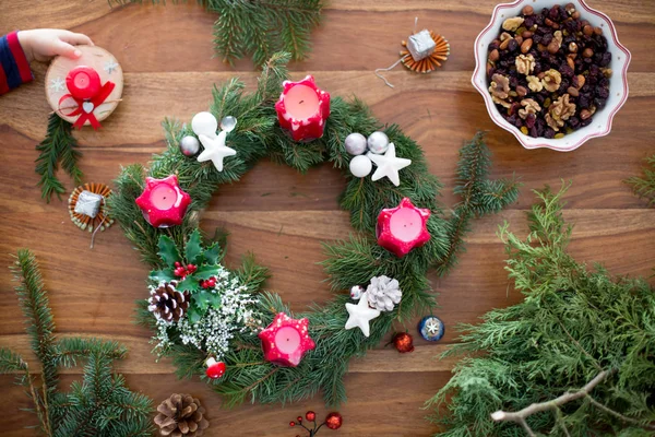 Little cute blonde toddler boy, making advent wreath at home — Stockfoto