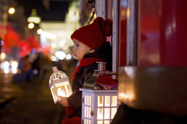 Sweet little toddler boy, holding lantern and a teddy bear at ni — ストック写真