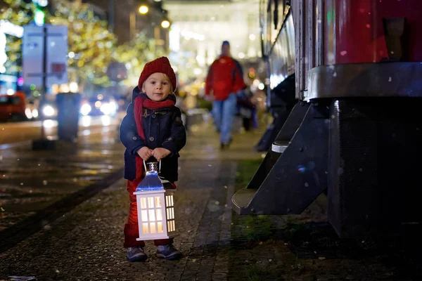Sweet little toddler boy, holding lantern and a teddy bear at ni — Stock Photo, Image