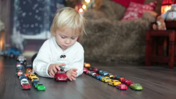 Cute Toddler Boy Sitting Many Car Toys Floor Playing Christmas — Stock Video