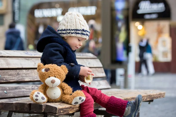 Fashion toddler boy with teddy bear toy, eating traditional Czec — Stock Photo, Image
