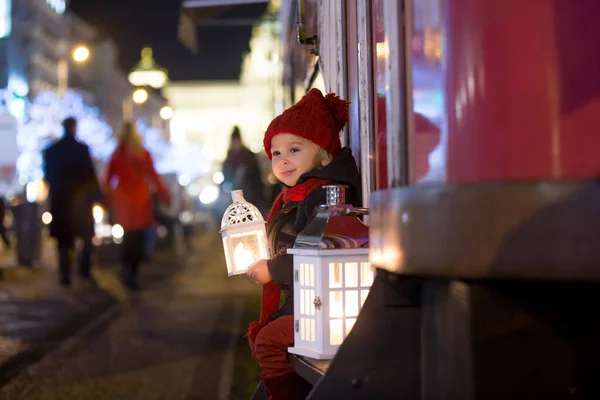 Sweet little toddler boy, holding lantern and a teddy bear at ni — ストック写真
