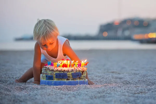 Sweet boys, celebrating on the beach birthday with car theme cak