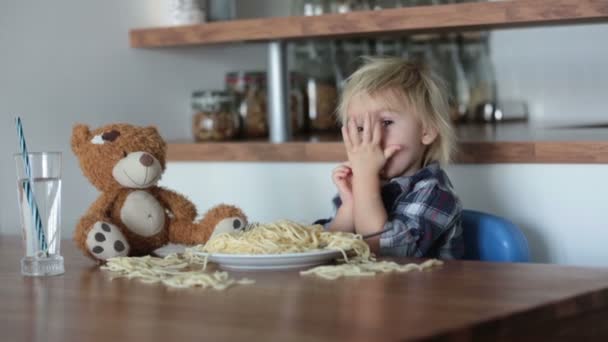 Sweet Little Blonde Child Boy Eating Spaghetti Home — Stock Video