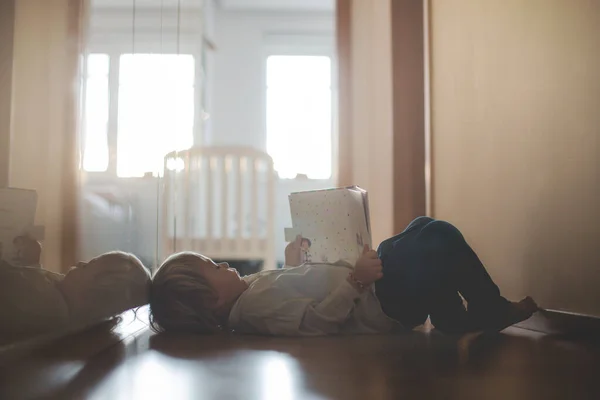 Beautiful Toddler Blond Boy Lying Floor Home Hall Reading Book — Stock Photo, Image