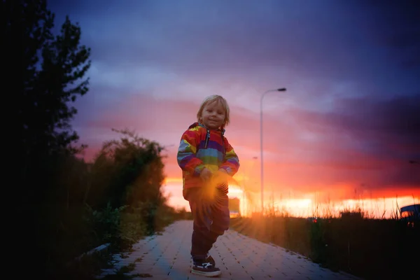 Cute Toddler Child Blond Boy Colorful Raincoat Holding Slinky Toy — Stock Photo, Image