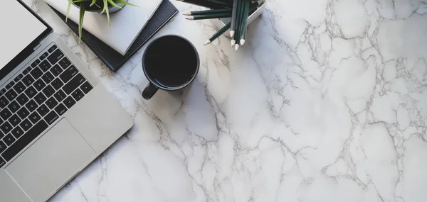 Top view of stylish workspace with laptop computer and office supplies on marble desk background — Stock Photo, Image