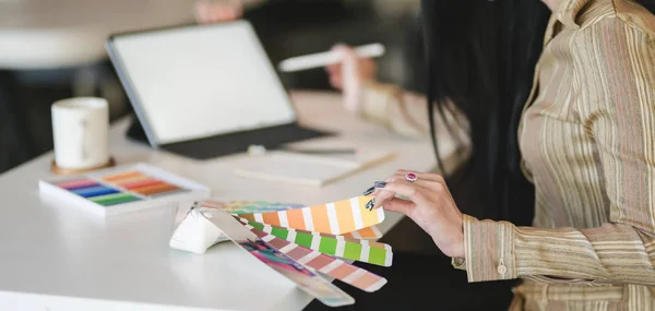 Cropped shot of young female designer working on her concept with digital tablet in comfortable office room — Stock Photo, Image