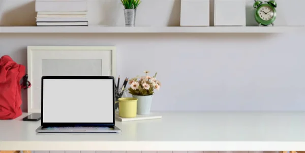 Cropped shot of comfortable workplace with blank screen laptop computer and office supplies — Stock Photo, Image