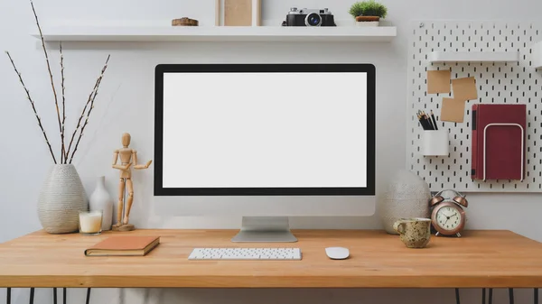 Cropped shot of blank screen desktop computer with office supplies and decorations on wooden table — Stock Photo, Image