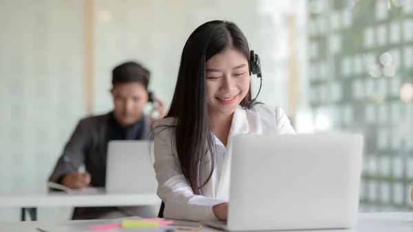 Close up view of customer service  talking on headset  in call centre operation room — Stock Photo, Image