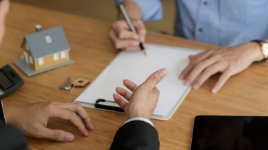 Cropped shot of Real estate agent presenting to male customer to decision making sign contract agreement