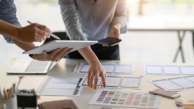 Close-up view of UI designer team planing their smartphone  template together