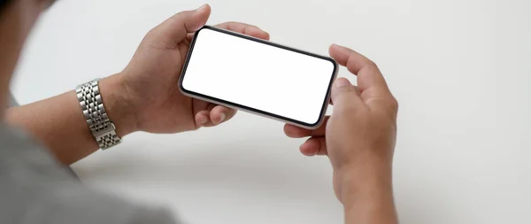 Cropped Shot Male Entrepreneur Holding Horizontal Mock Smartphone While Sitting — Stock Photo, Image