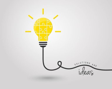 Fikir ve çözüm konsepti olarak yapboz parçalarından yapılmış parlak ampul