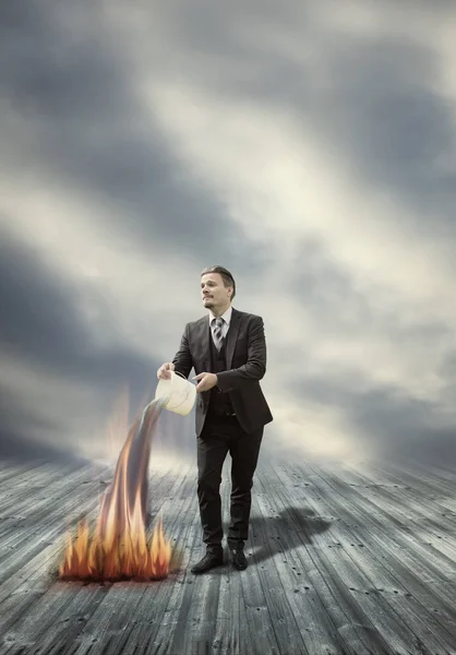 Businessman is Extinguishing Fire with Water - Keep Cool in Difficult Situation Concept — Stock Photo, Image