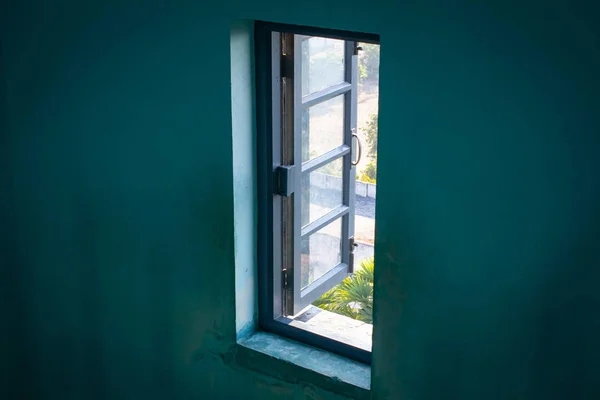An open window in a building wall.