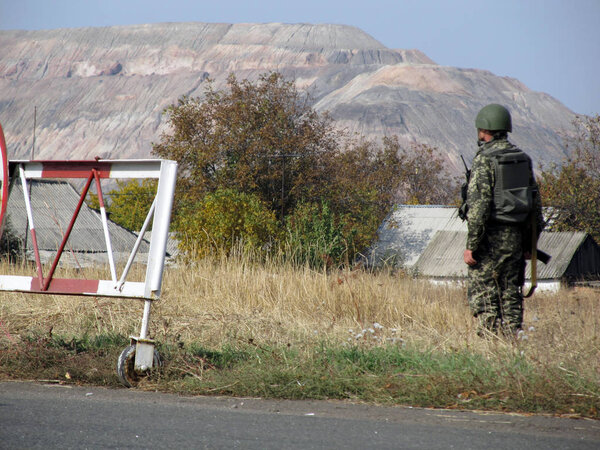 SELIDOVO, UKRAINE - OCTOBER, 2014: Ukrainian armed border guard