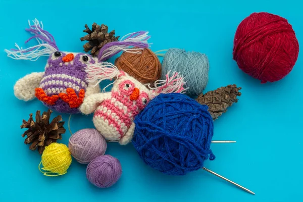 Cozy homely atmosphere. Female hobby knitting and Crochet. Yarn multicolor  in a basket. Skeins and balls. Stock Photo