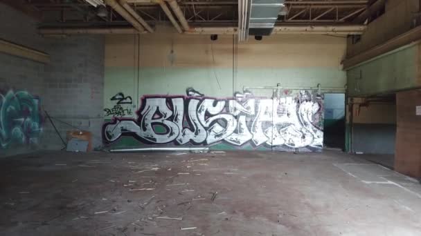 Abandoned Room Filmed Steadicam Showing Silver Graffiti — Stock Video