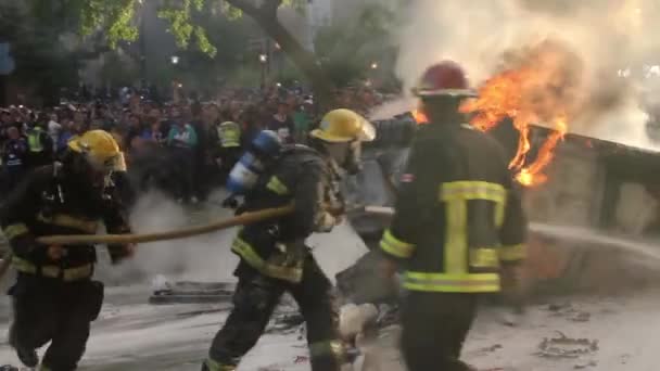Firemen Put Out Car Fire Large Rioting Crowd — Stock Video