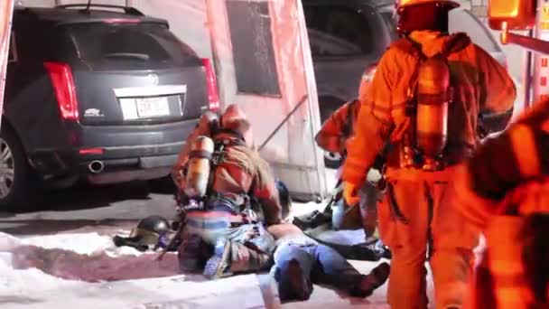 Firemen Resuscitating Unresponsive Male — Stock Video