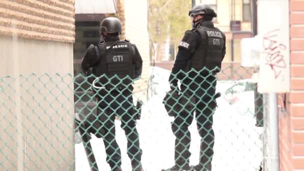 Two Swat Officers Standing Residential Building Guns — Stock Video