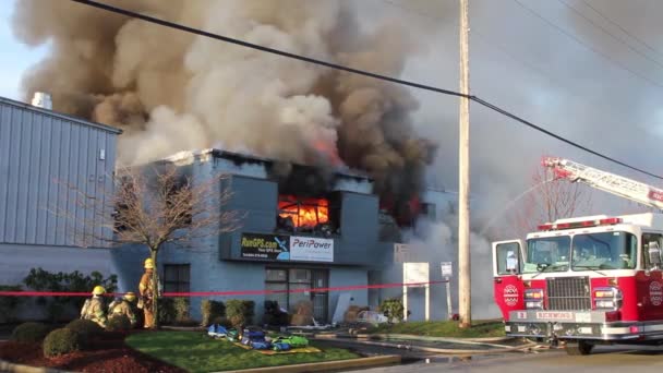 Intense Fire Burns Two Story Building Sending Flames Smoke High — Stock Video