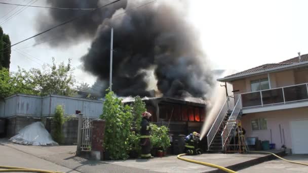 Heavy Black Smoke Rising Garage Fire Lit Direct Sunlight Vancouver — Stock Video