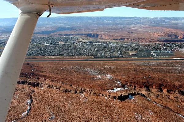 Landing strip of Page Airport and the town in the desert - view from the airplane, Page, AZ, US