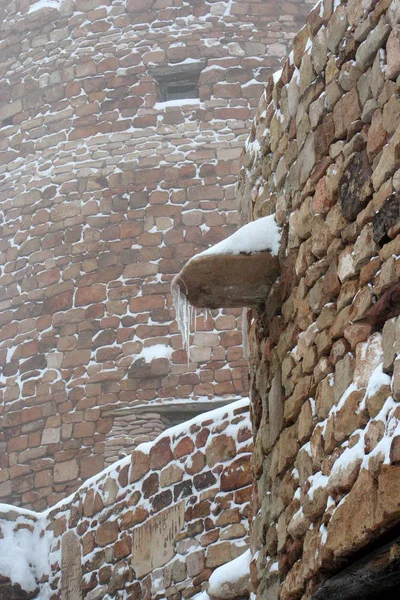 Icicles on the walls of the Watchtower at the Desert View Point on a snowy winter day, Grand Canyon, AZ, USA