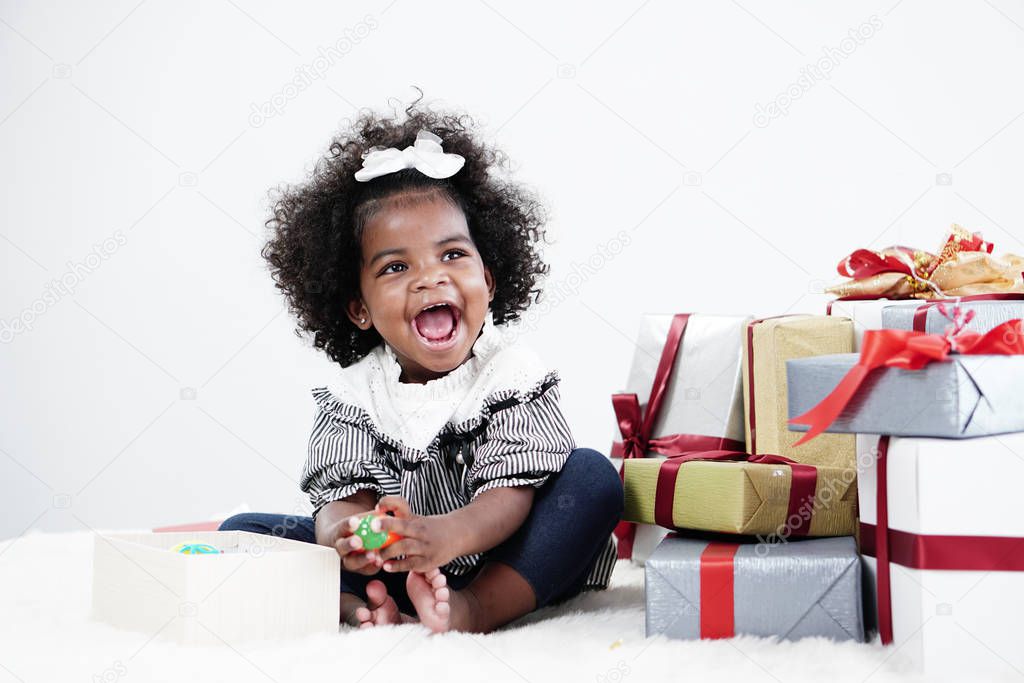 African american girl child having fun open gift box on her birt